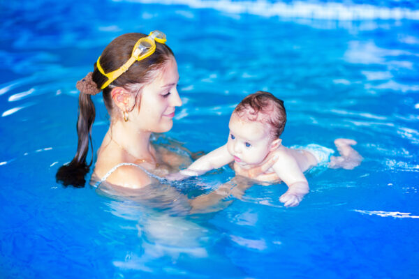 Mother and baby in swimming pool