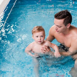 Swim,Instructor,Teaching,Cute,Toddler,Boy,In,Swimming,Pool