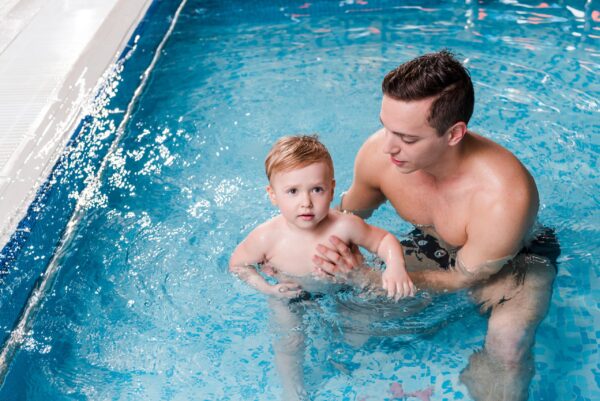 Swim,Instructor,Teaching,Cute,Toddler,Boy,In,Swimming,Pool